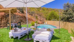 The swimming pool at or close to El Palomar Guaro by Ruralidays