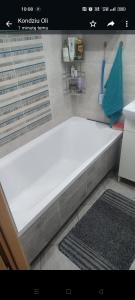 a white bath tub sitting in a bathroom at W Barlinku na rynku in Barlinek