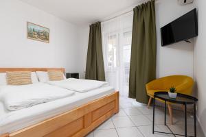 A bed or beds in a room at Ana & Josip