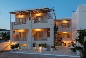 a view of a white building with lights at Mare in Galissas
