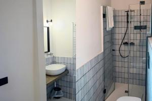 a bathroom with a sink and a toilet at A Casa Da Angelo - Country House PrivatePool & AirCO in Grottammare