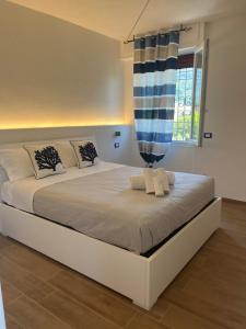 Ένα ή περισσότερα κρεβάτια σε δωμάτιο στο Elite19 Apartment Plus 39