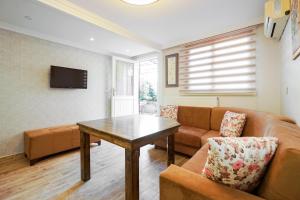 a living room with a couch and a table at Authentic Apartments OldCity in Istanbul