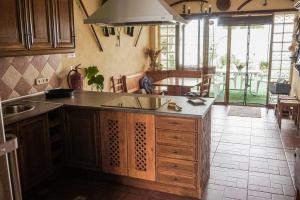 a kitchen with a sink and a counter top at Casa Jienense in Campillo del Río
