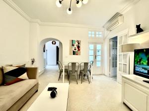 a living room with a couch and a table at COSY Apartment in Sidi Bou Said Village in Sidi Bou Saïd