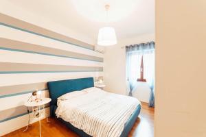 Ένα ή περισσότερα κρεβάτια σε δωμάτιο στο Casa in centro