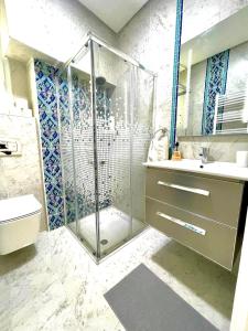 a bathroom with a shower and a sink at Cosy S3 Apartment in Sidi Bou Said Village in Sidi Bou Saïd