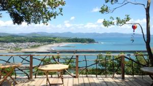 a balcony with a view of a body of water at Shimanto Yamamizuki - Vacation STAY 36953v in Shimanto