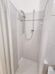 a bathroom with a shower with a glass door at Trilocale Rinascimento prima fila mare in San Benedetto del Tronto