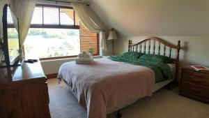 a bedroom with a large bed and a window at Willa Wuja Sama in Zawóz +80 photos