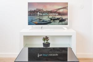 a display table with a picture of boats on it at GuestReady - Retreat near Matosinhos beach in Matosinhos