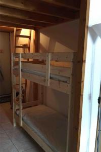 a set of bunk beds in a room at Appartement plein sud montagne et lacs in Habère-Poche