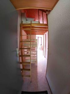 a hallway with a bunk bed in a room at Appartement plein sud montagne et lacs in Habère-Poche