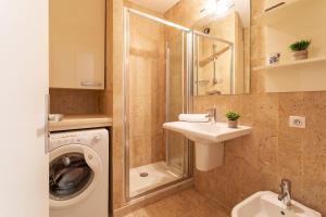 a bathroom with a washing machine and a sink at Résidence Gray d'Albion Studio BRA507 in Cannes +20 photos