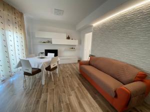 a living room with a couch and a table at VILLAGGIO LIDO - Cavallino in Cavallino-Treporti