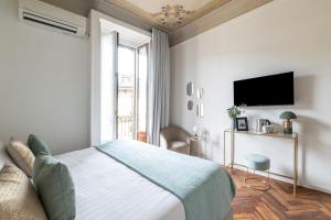 Säng eller sängar i ett rum på Easylife - Suite in Porta Venezia