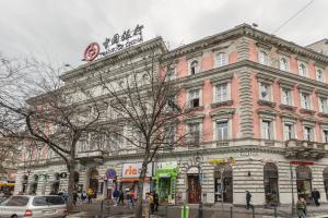 a large building on the corner of a street at Oktogon 4 Entire Aircon Apartment in Budapest