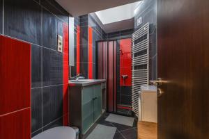 a bathroom with a toilet and a sink at Oktogon 4 Entire Aircon Apartment in Budapest