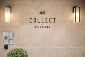 a building with a sign for a college residence at Collect Residence in Budapest