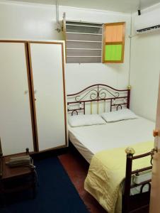 a bedroom with two beds and a window at seaview hostel in George Town