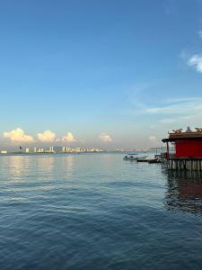 a view of a large body of water with a dock at seaview hostel in George Town