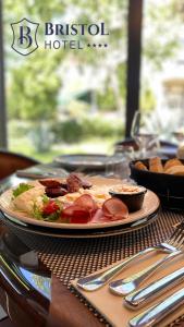 a plate of food on top of a table at Bristol Hotel Podgorica in Podgorica