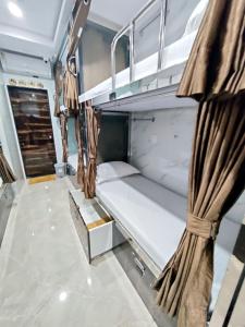 Postel nebo postele na pokoji v ubytování Hotel Comfy Inn