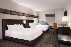 Ένα ή περισσότερα κρεβάτια σε δωμάτιο στο The Southlake Hotel