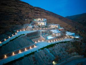 an aerial view of a building on a hill at night at Epithea Suites Kythnos 2 με ιδιωτικη πισινα in Kithnos