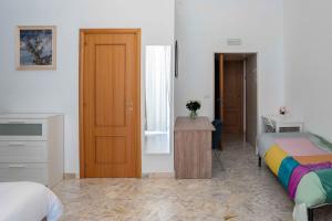 Postel nebo postele na pokoji v ubytování B&B Longobardi