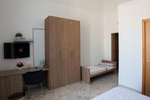 Postel nebo postele na pokoji v ubytování B&B Longobardi