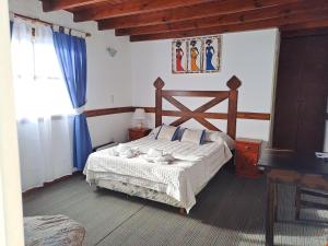 Cama ou camas em um quarto em Hostería Austral