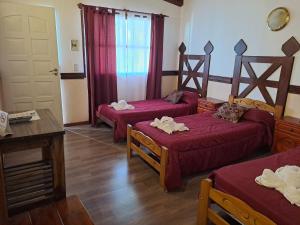 Cama ou camas em um quarto em Hostería Austral