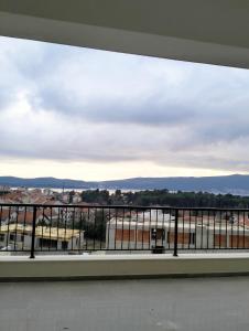 a window with a view of a city at Tivat Apartman in Tivat