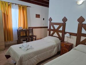 Cama ou camas em um quarto em Hostería Austral