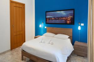 Postel nebo postele na pokoji v ubytování B&B Longobardi