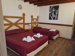 Cama ou camas em um quarto em Hostería Austral