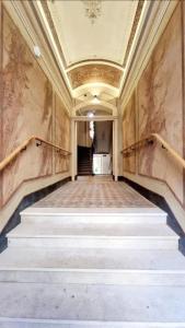 an empty hallway with stairs in a building at Tyzenhauz Apartments Siemiradzkiego Street in Krakow