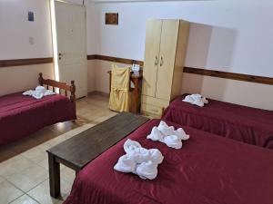 Cama ou camas em um quarto em Hostería Austral