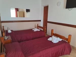 Cama ou camas em um quarto em Hostería Austral