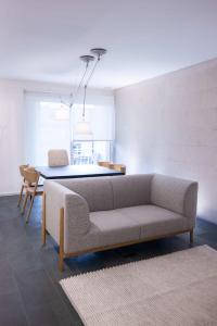 a living room with a couch and a table at Ampersand - Bright 2-Bedroom Apartment in Barcelona