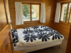 Voodi või voodid majutusasutuse Chalet Claire toas