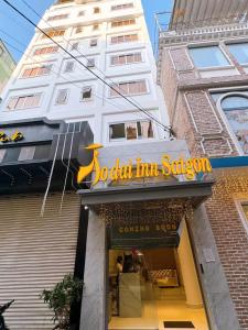 a store front of a building with a sign on it at Aodai Inn Saigon in Ho Chi Minh City