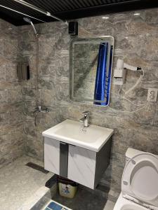 a bathroom with a sink and a mirror and a toilet at Horizon Boutique in Samarkand +27 photos