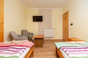 Postel nebo postele na pokoji v ubytování Janika Pension