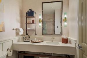 a bathroom with a sink and a mirror at The Lodge at Zion Country in Springdale