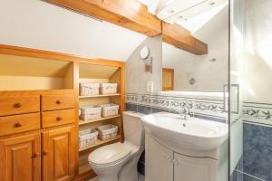 a bathroom with a toilet and a sink at Smartstay au reve Savoyard - Studio N-6 in Morillon