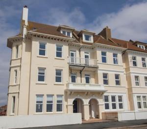 a large building with a balcony on top of it at Beach Haven Apartment By Air Premier in Seaford