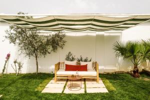 a living room with a couch and a table at Amagatay Menorca in Alaior