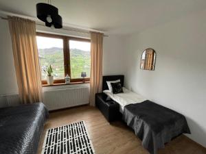 Posteľ alebo postele v izbe v ubytovaní Apartamenty ''Chcę Tu Zostać''